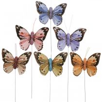 Motyle piórkowe, motyle ozdobne na patyku, wtyki kwiatowe różowe, pomarańczowe, fioletowe, brązowe, niebieskie, beżowe 6×8cm 12szt