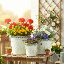 Produkt Doniczka metalowa z tłoczonym wzorem i uchwytami, biało-zielona, w stylu shabby chic, wys. 22/19,5/17,5 cm, śr. 25,5/20,5/15,5 cm, zestaw 3 szt.