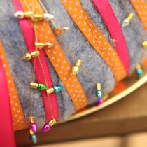 Produkt Wstążka prezentowa ozdobna w kropki pomarańczowa 10mm 25m