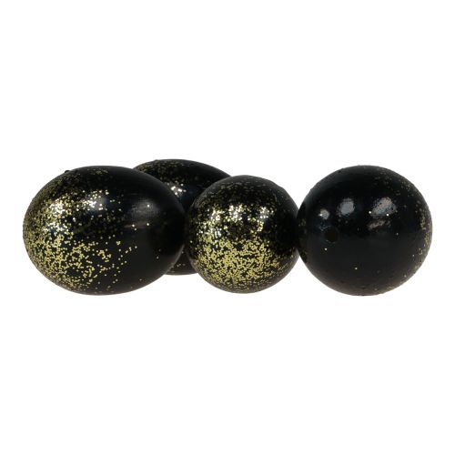 Produkt Ozdobne pisanki prawdziwe gęsie jajo czarne ze złotym brokatem wys. 7,5–8,5 cm 10 sztuk
