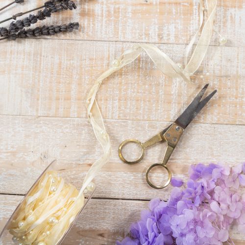 Produkt Wstążka dekoracyjna z perełkami, kremowa, 20mm, 5m