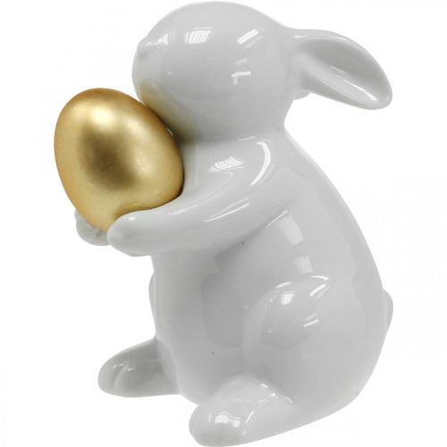 Floristik24 Królik ze złotym jajkiem ceramika, dekoracja wielkanocna elegancki biały, złoty wys. 15 cm