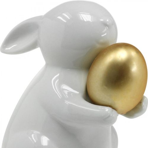 Floristik24 Królik ze złotym jajkiem ceramika, dekoracja wielkanocna elegancki biały, złoty wys. 15 cm