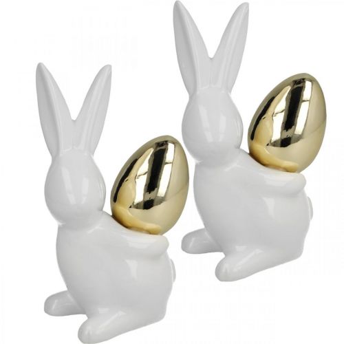 Floristik24 Króliki ze złotym jajkiem, ceramiczne króliki na wielkanoc szlachetne białe, złote W13cm 2szt