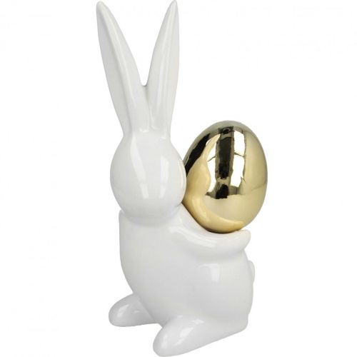 Floristik24 Zajączki wielkanocne eleganckie, ceramiczne zajączki ze złotym jajkiem, dekoracja wielkanocna biała, złota W18cm 2szt