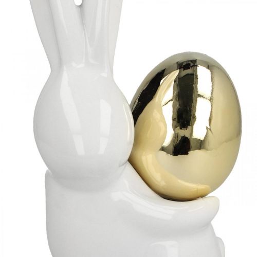 Floristik24 Zajączki wielkanocne eleganckie, ceramiczne zajączki ze złotym jajkiem, dekoracja wielkanocna biała, złota W18cm 2szt