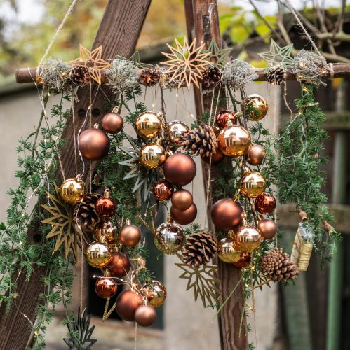 Produkt Ozdoby choinkowe drewniane śnieżynki zielone 10cm 12 szt